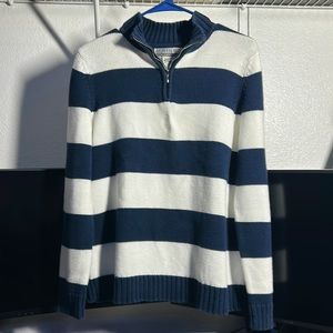 A small crew neck sweater which is from nine and company.